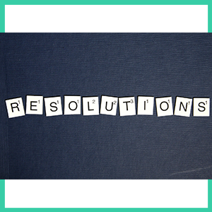 December 2021 Resolutions - image from Pexels of the word RESOLUTIONS written with Scrabble letters surrounded by a sea green and white border